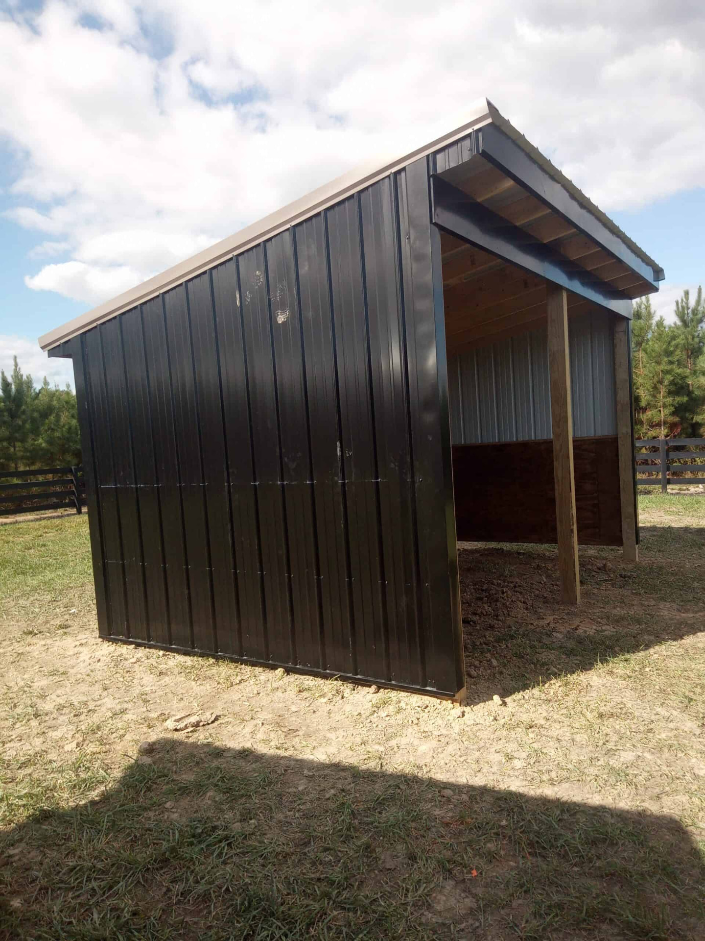 Black metal run-in shed built by M&J Construction