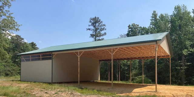 Open-sided pole barn built by M&J Construction